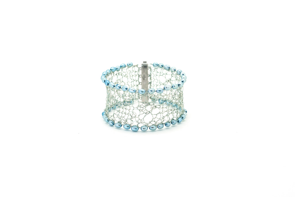 silver knit lace cuff edged with aqua coloured pearls.